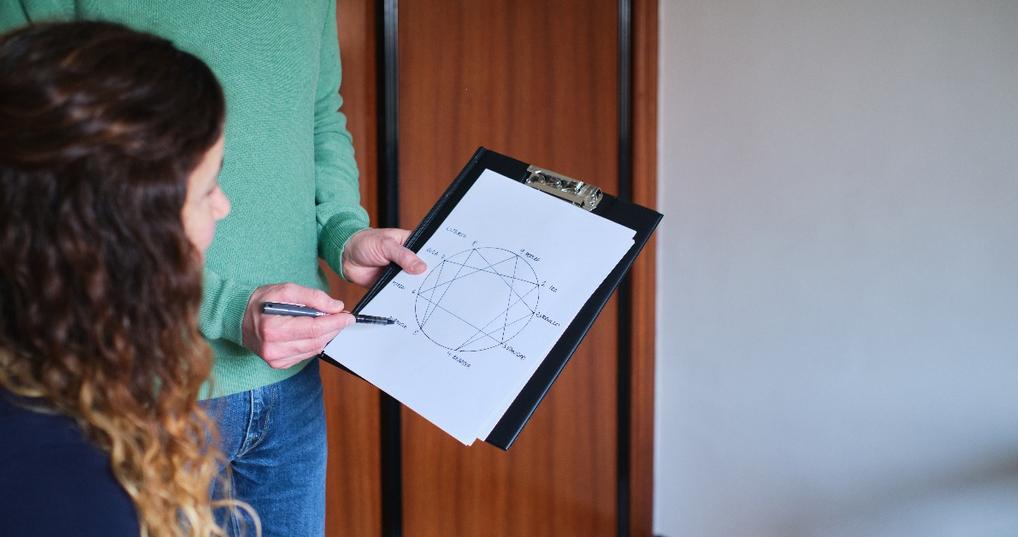 hand writing notes during a counseling session 