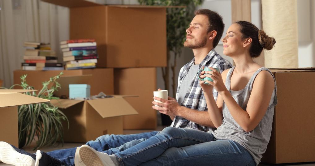 happy couple moving home resting breathing fresh air