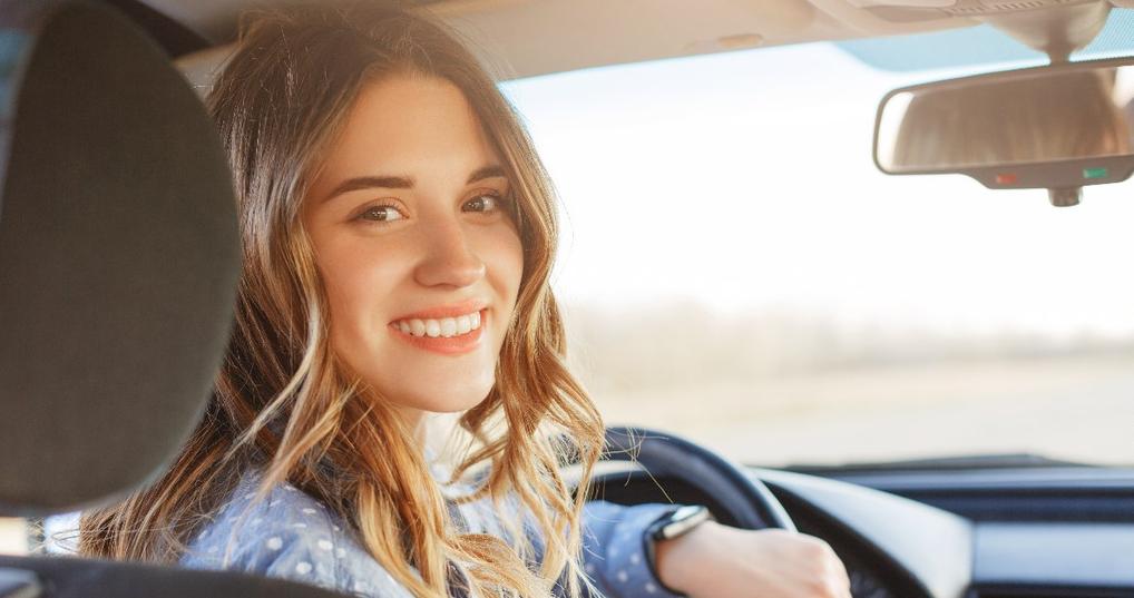 Woman smiling in car