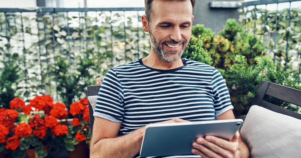 Guy smiling looking at phone