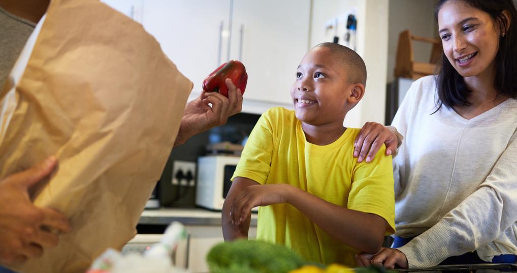 family unpacking the groceries