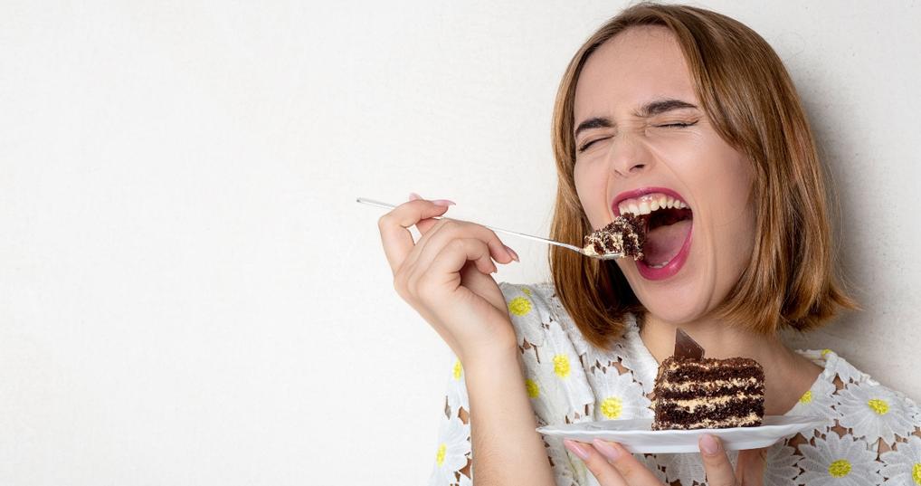 eating tasty chocolate cake