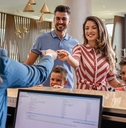Family checking in at hotel