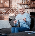 Senior woman holding check