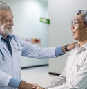 senior doctor and elderly patient happiness together