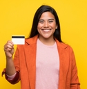 Young woman holding a credit card
