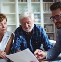 Senior couple planning their investments with financial advisor