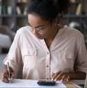 woman sitting at desk managing budget 