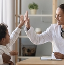 doctor, child, and father during a doctor visit