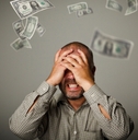 frustrated man and falling dollars