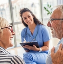 female nurse talking to senior patients