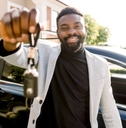 car seller holding car keys