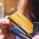 woman choosing credit card to make payment