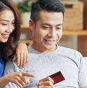 Couple using a credit card