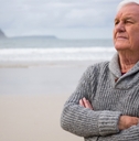 thoughtful senior man standing 