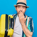 shocked man with luggage