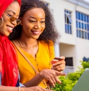 Two young women learning about credit cards