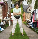 woman welcoming clients to yard sale