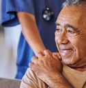 doctor offering support to senior patient