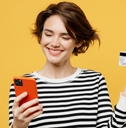Smiling woman holding a phone and credit card