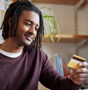College student looking at credit card