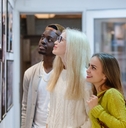multi ethnic friends at art gallery