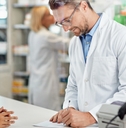 pharmacist writing prescription