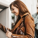 Woman taking money out of an ATM