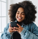 Smiling woman using her phone