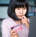 girl holding credit card