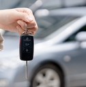 giving car key to new owner