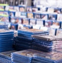 cds and dvds on piles at store