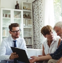 senior couple planning investments with financial advisor