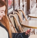 Woman sitting outside cafe