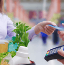 person using credit card on groceries