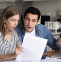 couple analyzing financial documents