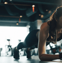 person doing planks at the gym