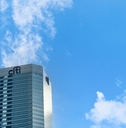 Citibank skyscraper against a blue sky with clouds