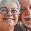 close up of smiling retired couple
