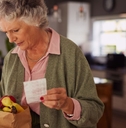 older woman with groceries