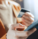 Woman's hands with phone and credit card