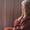 senior lady in depression sitting on couch at home covering her face with hands