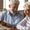 senior couple reviewing bills at table