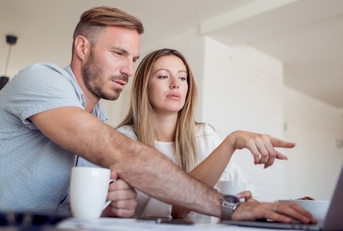 Couple looking at computer