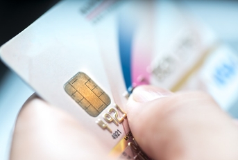 closeup of hand holding credit card