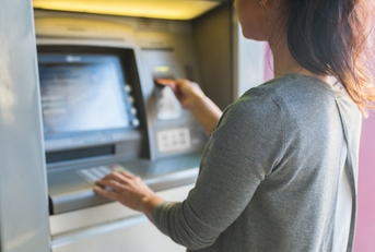 woman using ATM