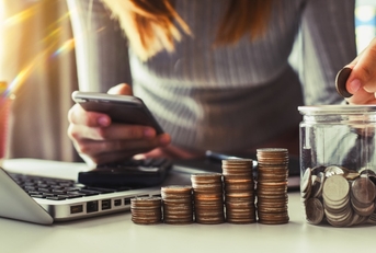Woman with stack of coins