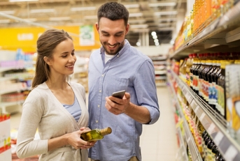 Couple on phone at grocery store