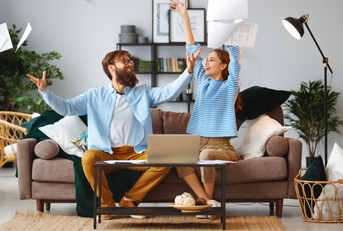 Couple throwing paperwork