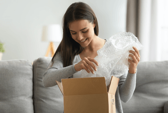 Woman opening an Amazon package 